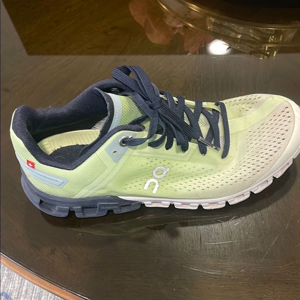 On Running Green and Blue Athletic Shoes with Modern Design